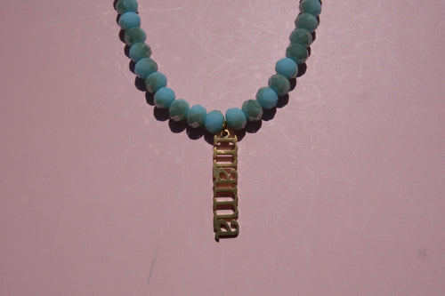 Baby Blue beaded necklace with Mama charm