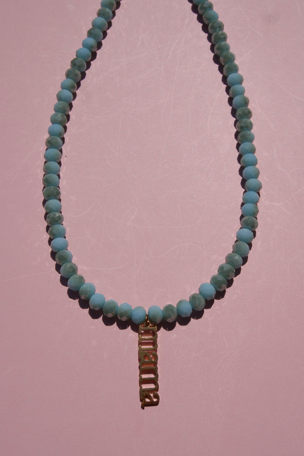 Baby Blue beaded necklace with Mama charm