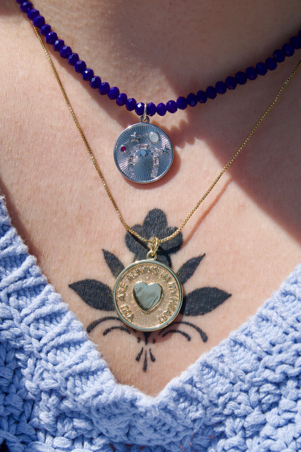 Navy beaded lucky coin necklace.